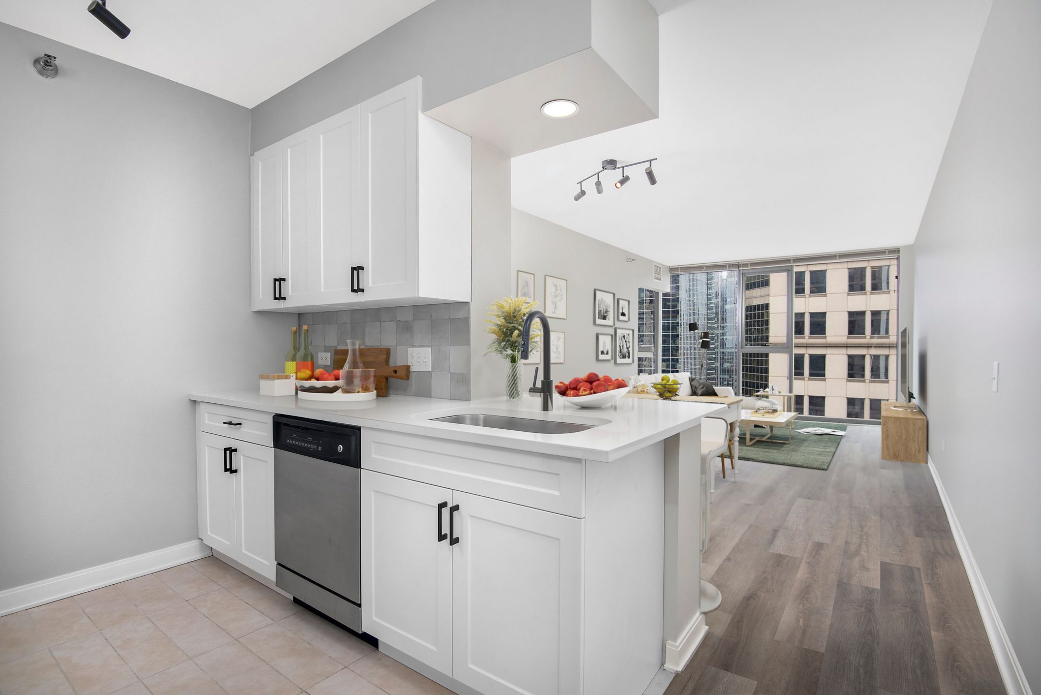 apartment kitchen with white cabinetry